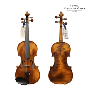 Two violins displayed side by side on a white background, front view left and back view right, with tags; Conrad Götz logo top-right.